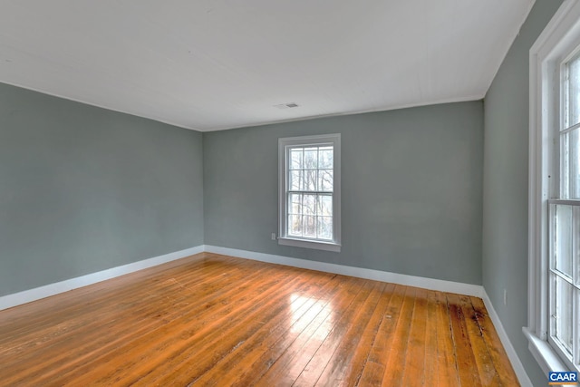 spare room featuring hardwood / wood-style floors