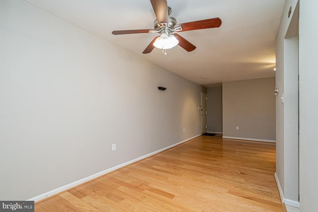 unfurnished room featuring ceiling fan and light hardwood / wood-style floors