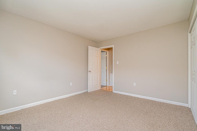 unfurnished bedroom featuring carpet flooring