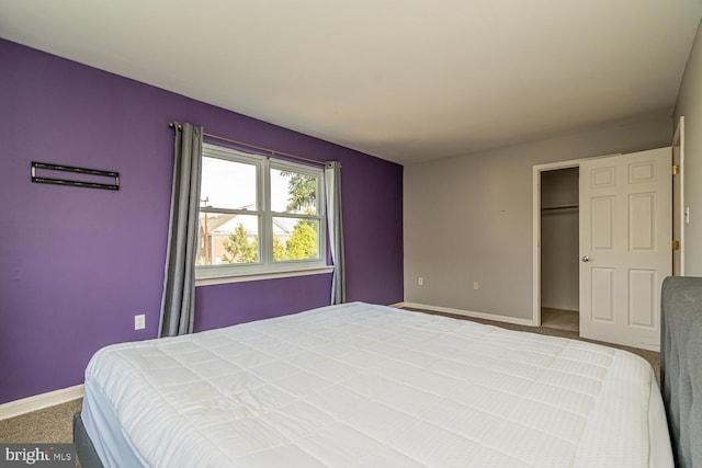 bedroom with carpet floors and a closet