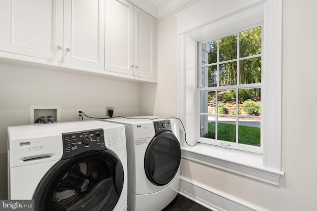 laundry room featuring cabinets, separate washer and dryer, and ornamental molding