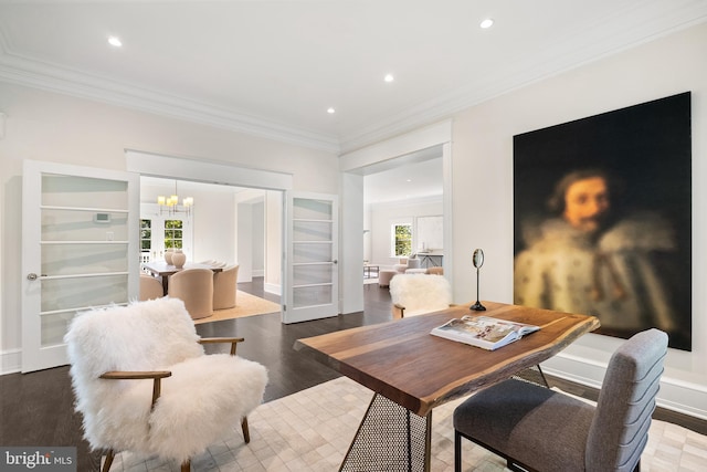 dining area featuring french doors, built in shelves, crown molding, dark wood-type flooring, and a notable chandelier