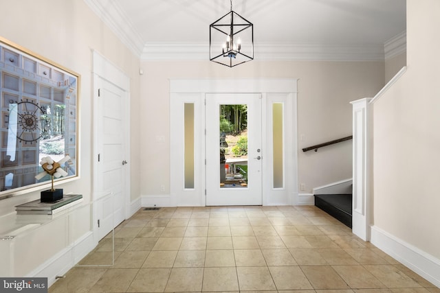 entrance foyer featuring crown molding, light tile patterned floors, and an inviting chandelier