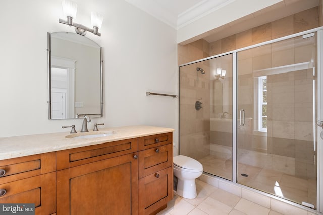 bathroom with tile patterned floors, toilet, ornamental molding, and a shower with door