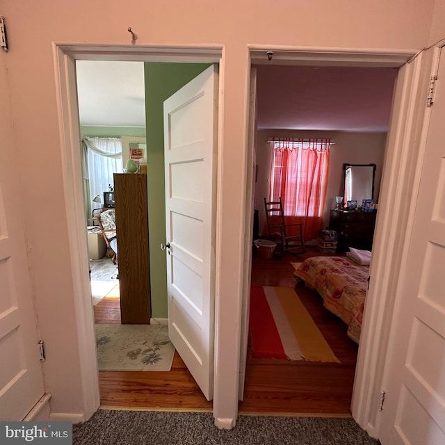 corridor featuring hardwood / wood-style flooring