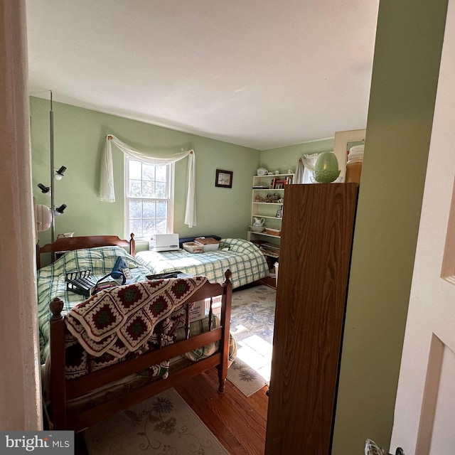 bedroom with wood-type flooring