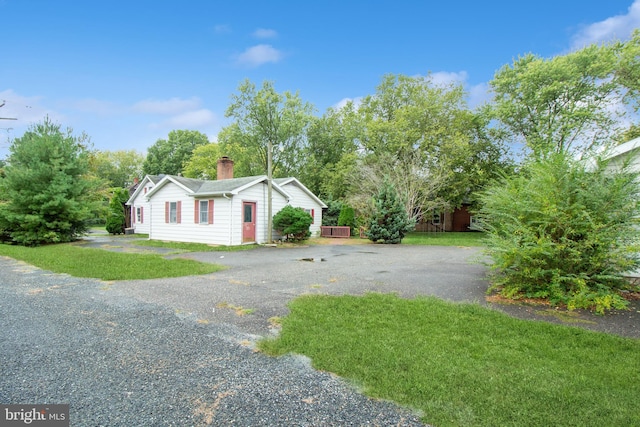 view of property exterior featuring a yard