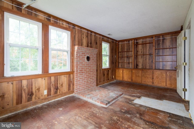 interior space featuring wood walls and dark wood-type flooring