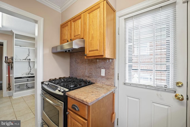 kitchen featuring light tile patterned floors, a wealth of natural light, gas range, and tasteful backsplash