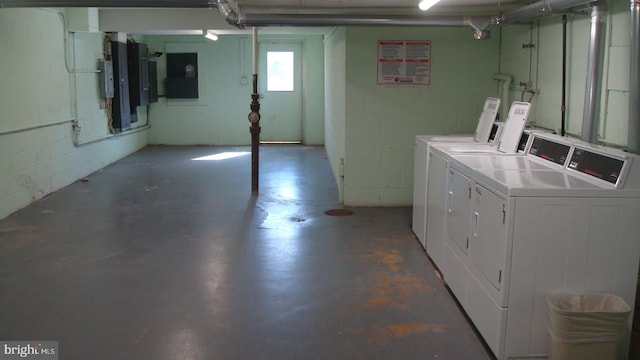 basement featuring washing machine and clothes dryer