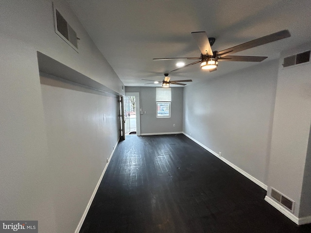 unfurnished room with dark hardwood / wood-style floors and ceiling fan