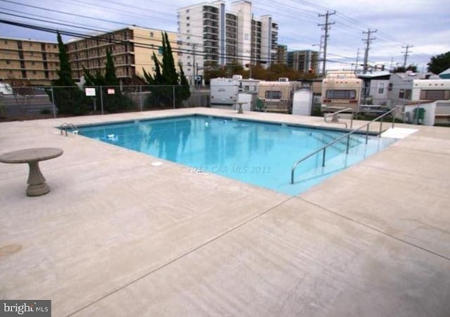 view of pool featuring a patio area