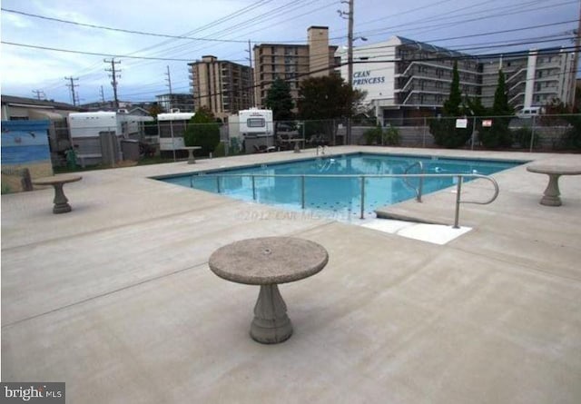 view of swimming pool featuring a patio