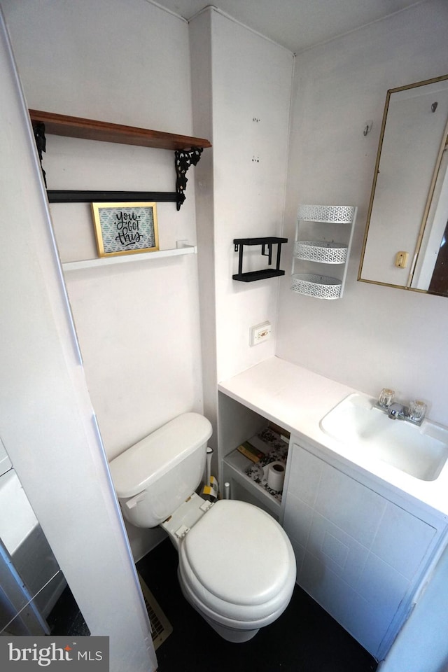 bathroom with vanity and toilet