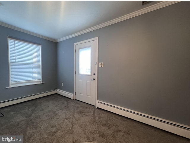 entryway with crown molding, a baseboard heating unit, and carpet floors