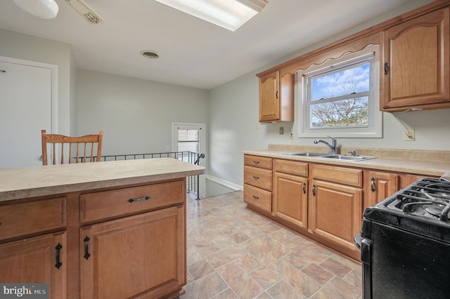 kitchen with black stove and sink