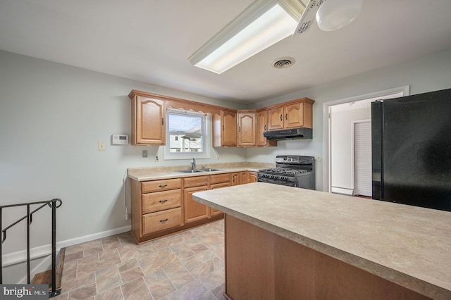 kitchen with sink and black appliances