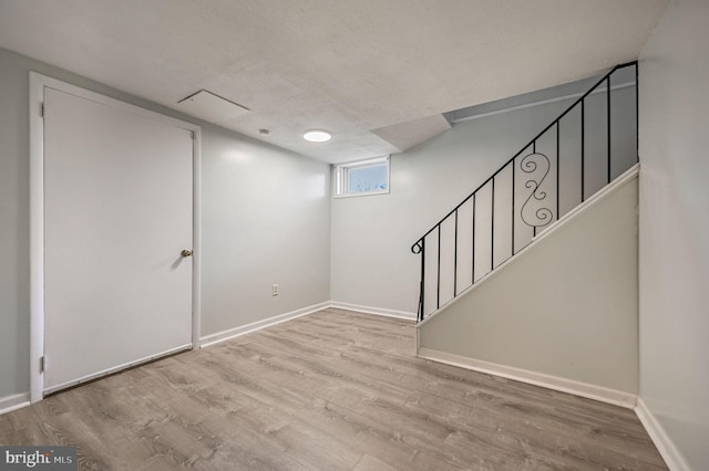 basement featuring light wood-type flooring