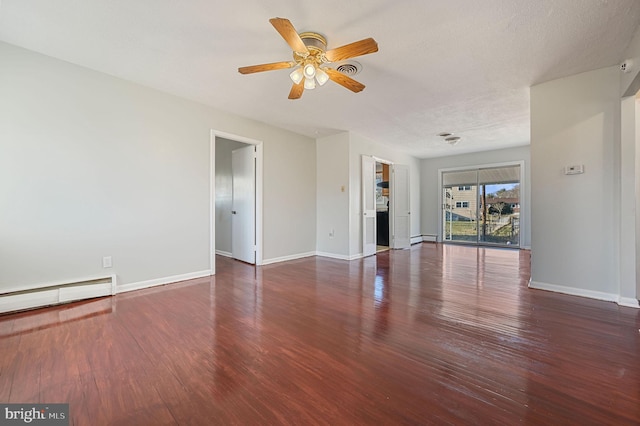 spare room featuring ceiling fan, dark hardwood / wood-style flooring, and a baseboard radiator