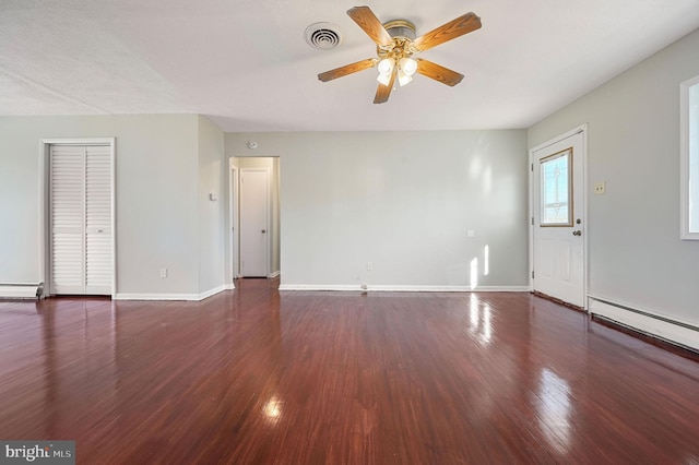 unfurnished room with dark hardwood / wood-style floors, baseboard heating, and ceiling fan