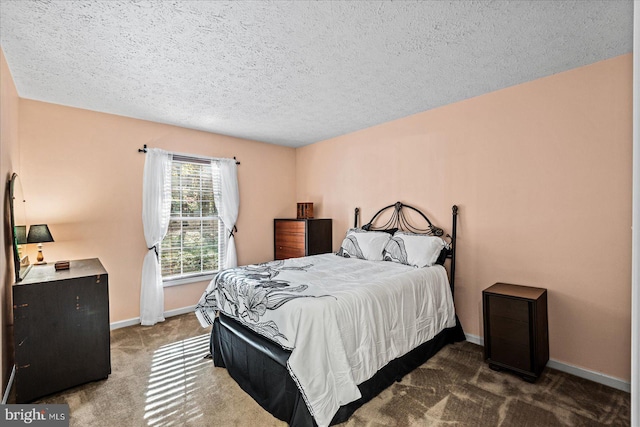 carpeted bedroom with a textured ceiling