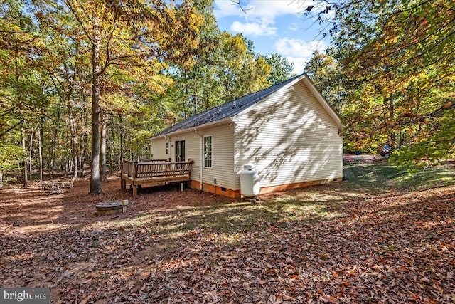 view of side of property with a deck