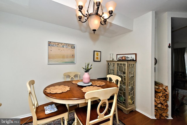 dining space with a chandelier and wood-type flooring