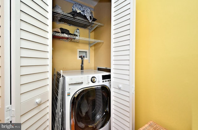 laundry room featuring washer / dryer