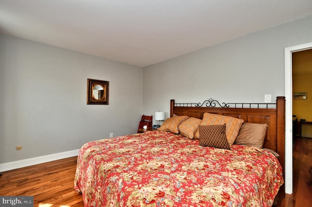 bedroom featuring hardwood / wood-style flooring