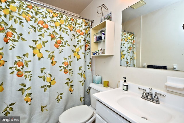 bathroom with vanity, toilet, and a shower with curtain