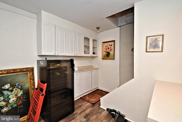 kitchen featuring white cabinets and dark hardwood / wood-style floors