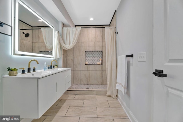 bathroom featuring vanity, tile patterned flooring, and a shower with shower curtain