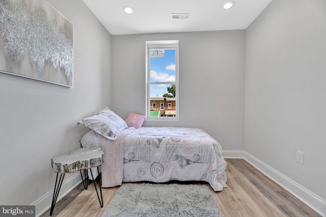 bedroom with wood-type flooring