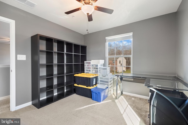 interior space with ceiling fan