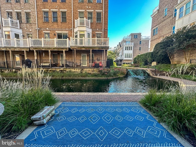 view of swimming pool with a water view