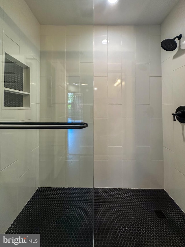 bathroom featuring an enclosed shower