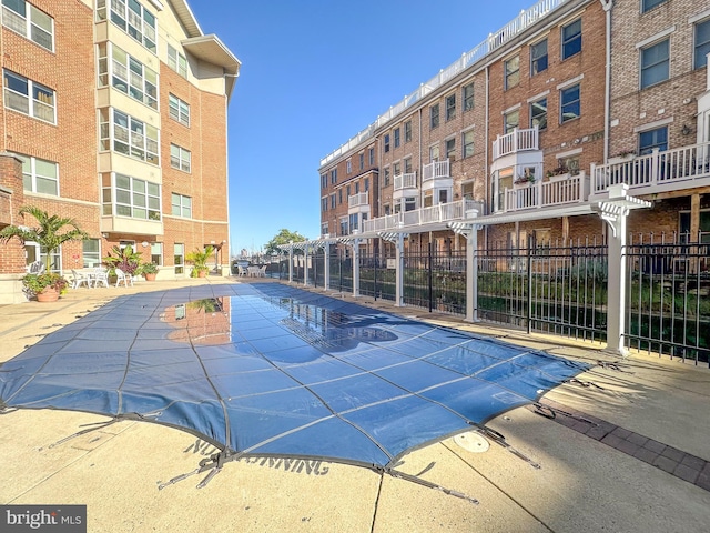 view of swimming pool featuring a patio area