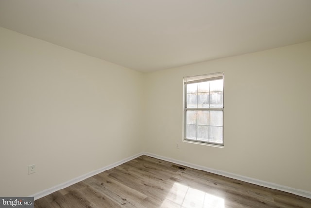 unfurnished room featuring light hardwood / wood-style floors