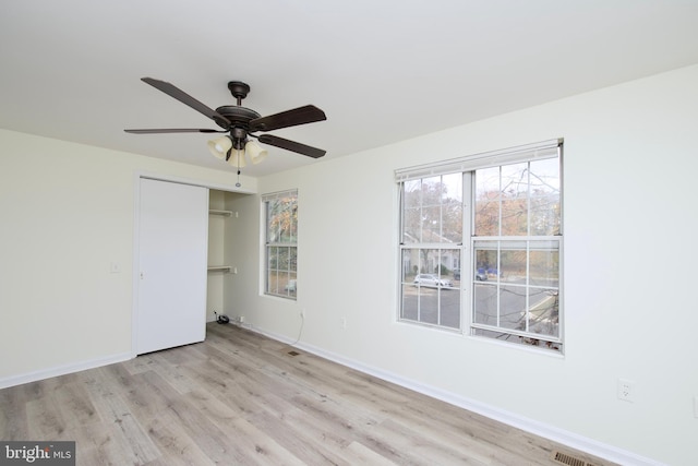 unfurnished room featuring ceiling fan and light hardwood / wood-style flooring