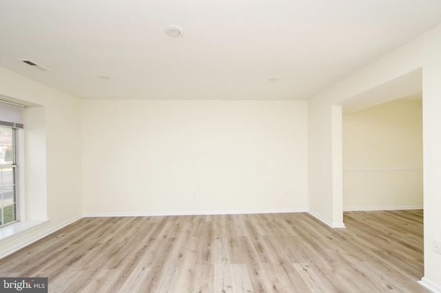 spare room featuring light hardwood / wood-style floors