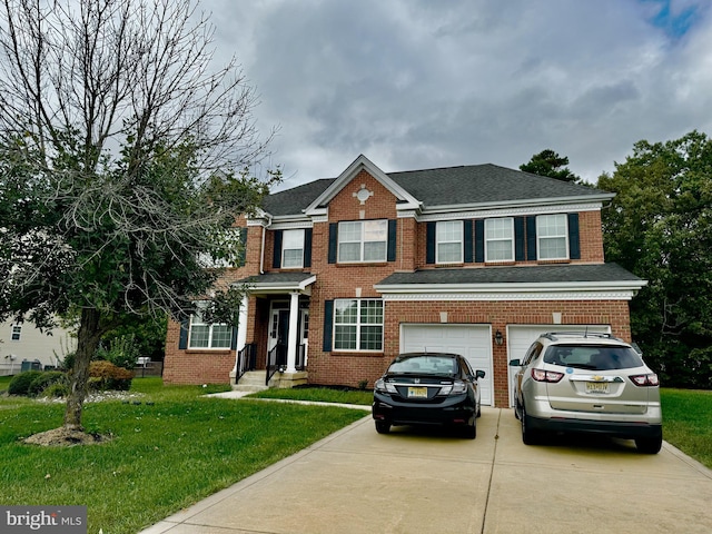 view of front of home featuring a front lawn and a garage