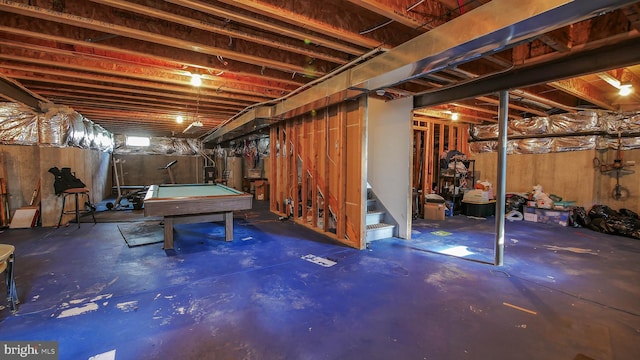 basement featuring pool table and water heater