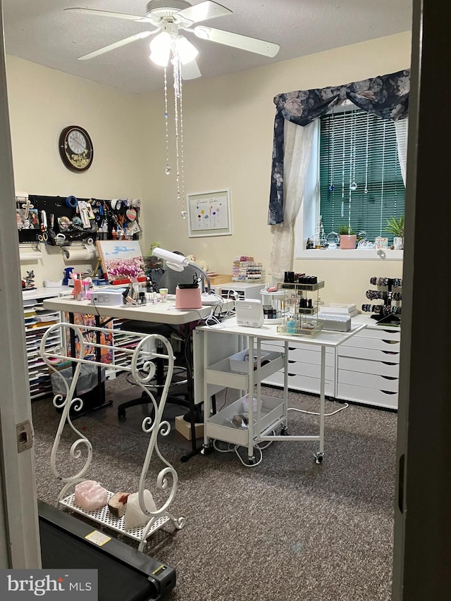 office space featuring ceiling fan and a textured ceiling