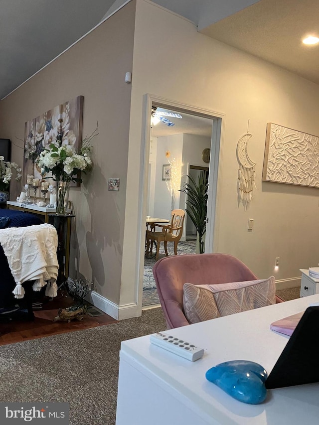 dining room featuring dark carpet