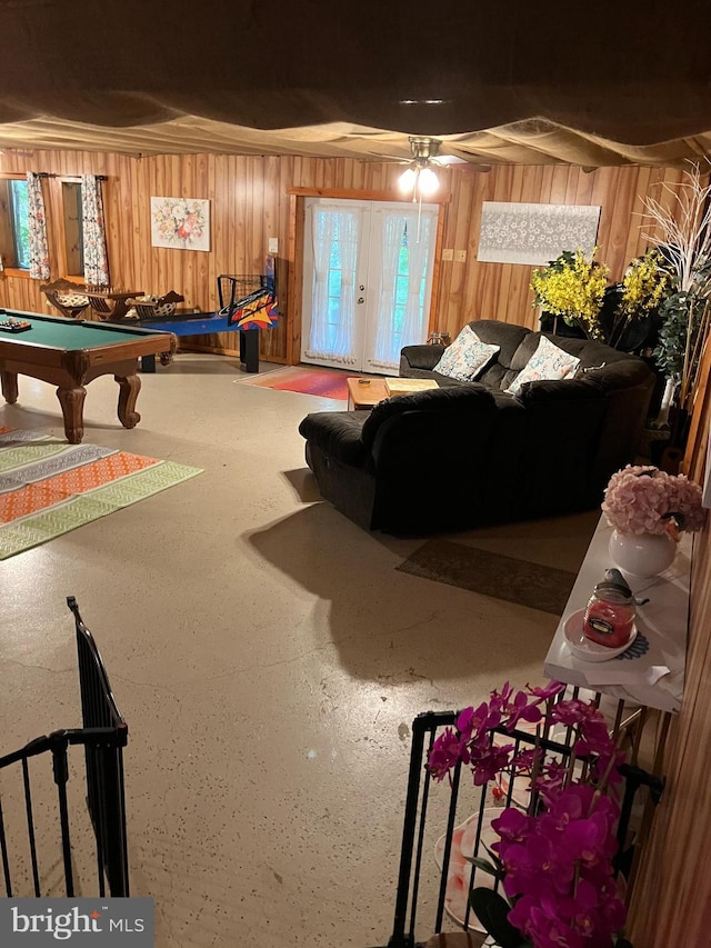 game room featuring pool table and wood walls