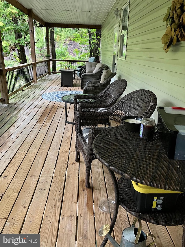 wooden deck with outdoor lounge area