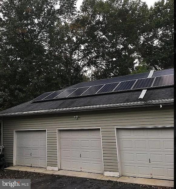 garage featuring solar panels