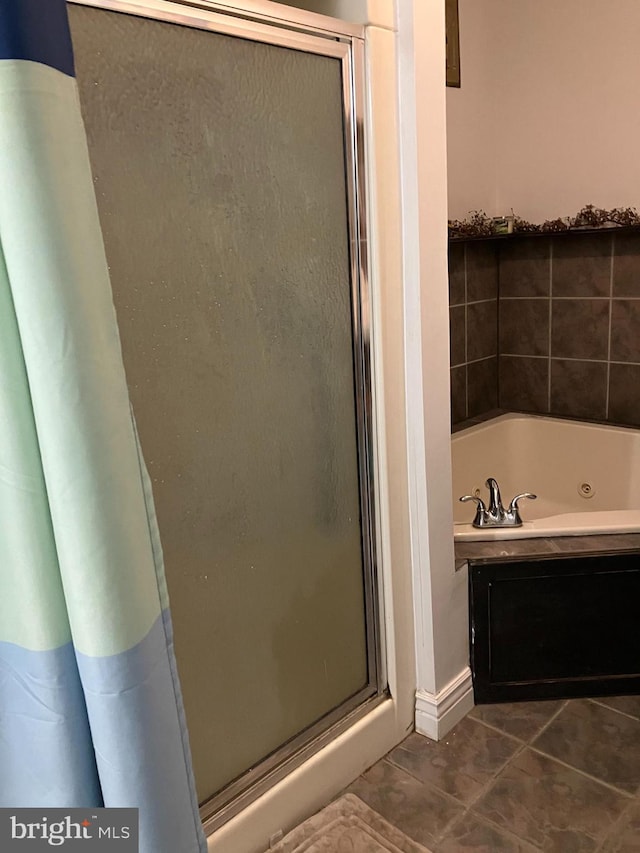 bathroom featuring tile patterned floors and plus walk in shower