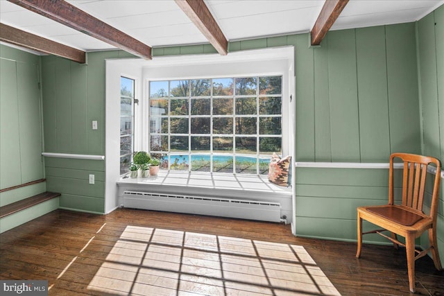 unfurnished sunroom featuring a baseboard heating unit and beamed ceiling