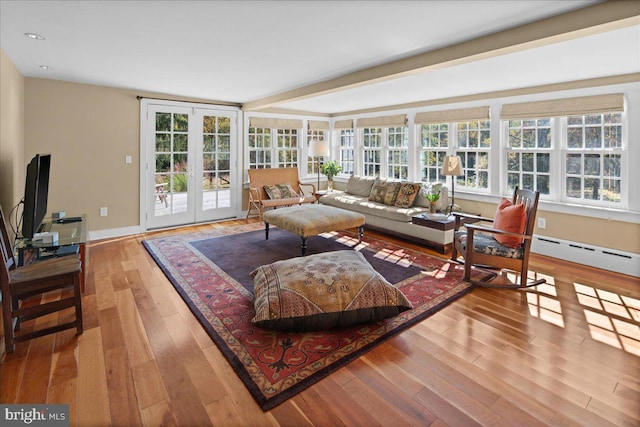 living room featuring hardwood / wood-style floors, a healthy amount of sunlight, and french doors